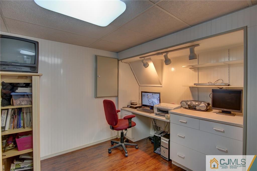 5 McEvoy Road Edison, NJ 08837 - Photo 17 of 22 a view of a workspace with furniture and a window