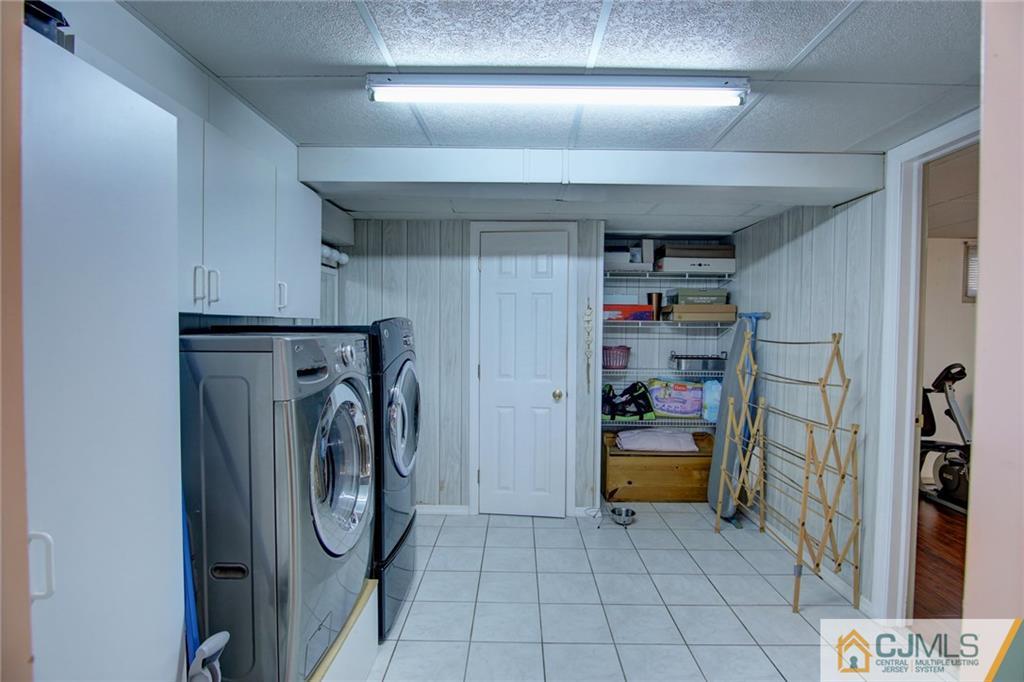 5 McEvoy Road Edison, NJ 08837 - Photo 18 of 22 a utility room with closet dryer and washer
