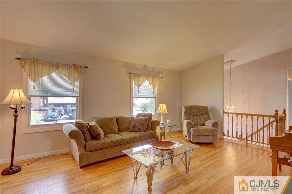 5 McEvoy Road Edison, NJ 08837 - Photo 5 of 22 a living room with furniture and a wooden floor