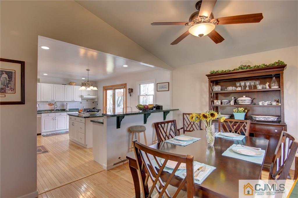 5 McEvoy Road Edison, NJ 08837 - Photo 8 of 22 a living room with stainless steel appliances kitchen island granite countertop furniture and a kitchen view