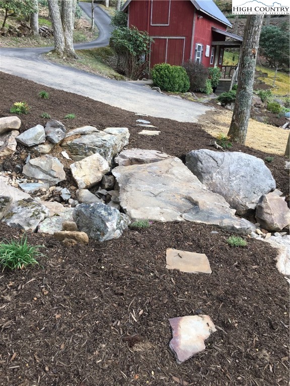 127-129 Rim Rock Gorge Road Blowing Rock, NC 28605 - Photo 13 of 15 a view of a yard with plants