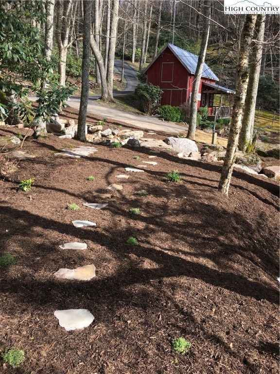 127-129 Rim Rock Gorge Road Blowing Rock, NC 28605 - Photo 14 of 15 a view of a house with a yard