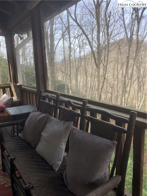127-129 Rim Rock Gorge Road Blowing Rock, NC 28605 - Photo 7 of 15 a living room with furniture and wooden floor