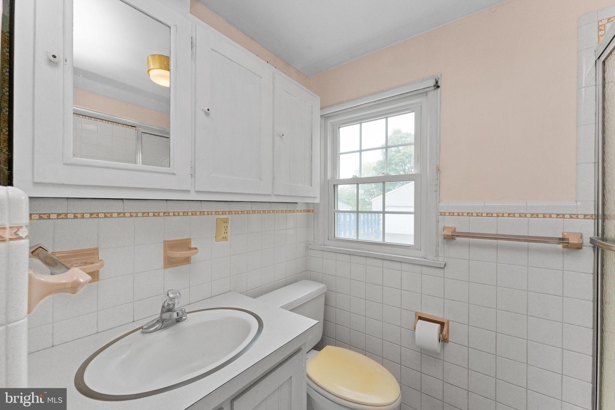 108 Jackson Road Gilbertsville, PA 19525 - Photo 17 of 29 a bathroom with a sink a toilet and a mirror