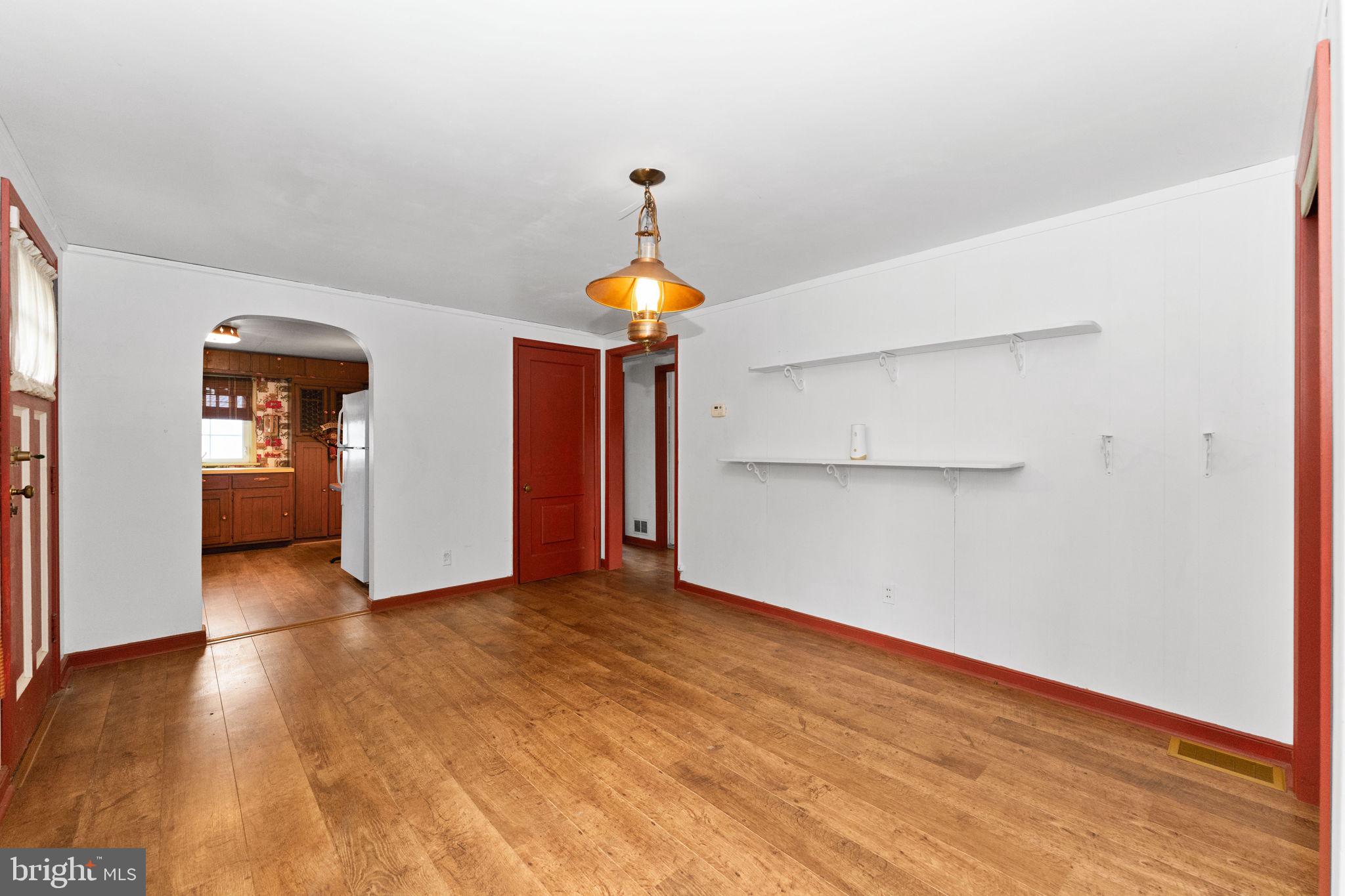 108 Jackson Road Gilbertsville, PA 19525 - Photo 6 of 29 a view of empty room with wooden floor and fireplace
