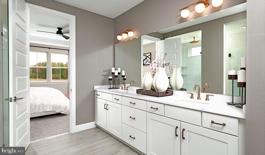 19004 Amesbury Road Hagerstown, MD 21742 - Photo 9 of 16 a en suite bathroom with double vanity and a mirror