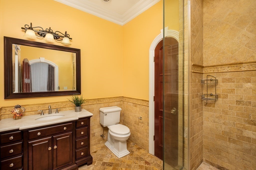 7 Evergreen Avenue Weston, MA 02493 - Photo 11 of 42 a bathroom with a toilet sink and mirror