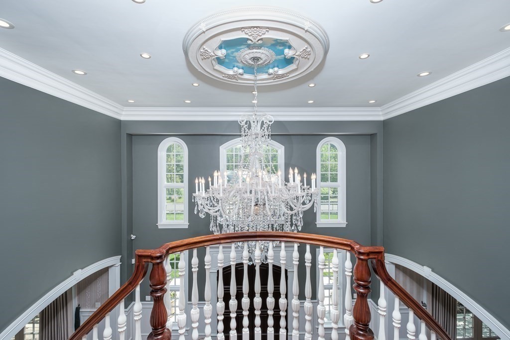 7 Evergreen Avenue Weston, MA 02493 - Photo 14 of 42 a view of a hallway with a chandelier