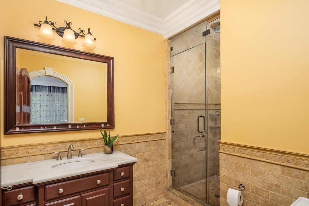 7 Evergreen Avenue Weston, MA 02493 - Photo 19 of 42 a bathroom with a sink and a mirror