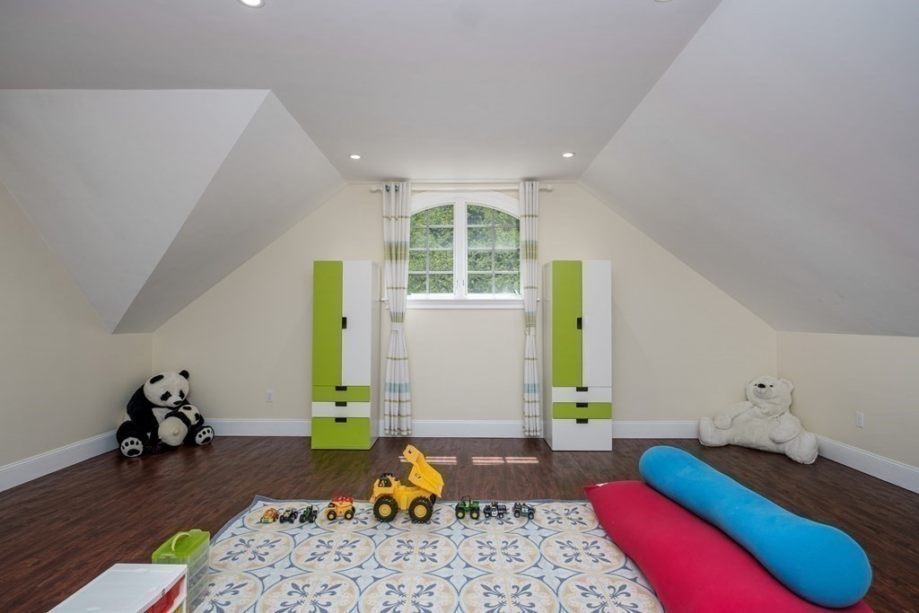7 Evergreen Avenue Weston, MA 02493 - Photo 20 of 42 a bedroom with a bed and wooden floor