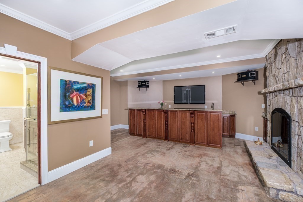 7 Evergreen Avenue Weston, MA 02493 - Photo 26 of 42 a living room with furniture and a flat screen tv