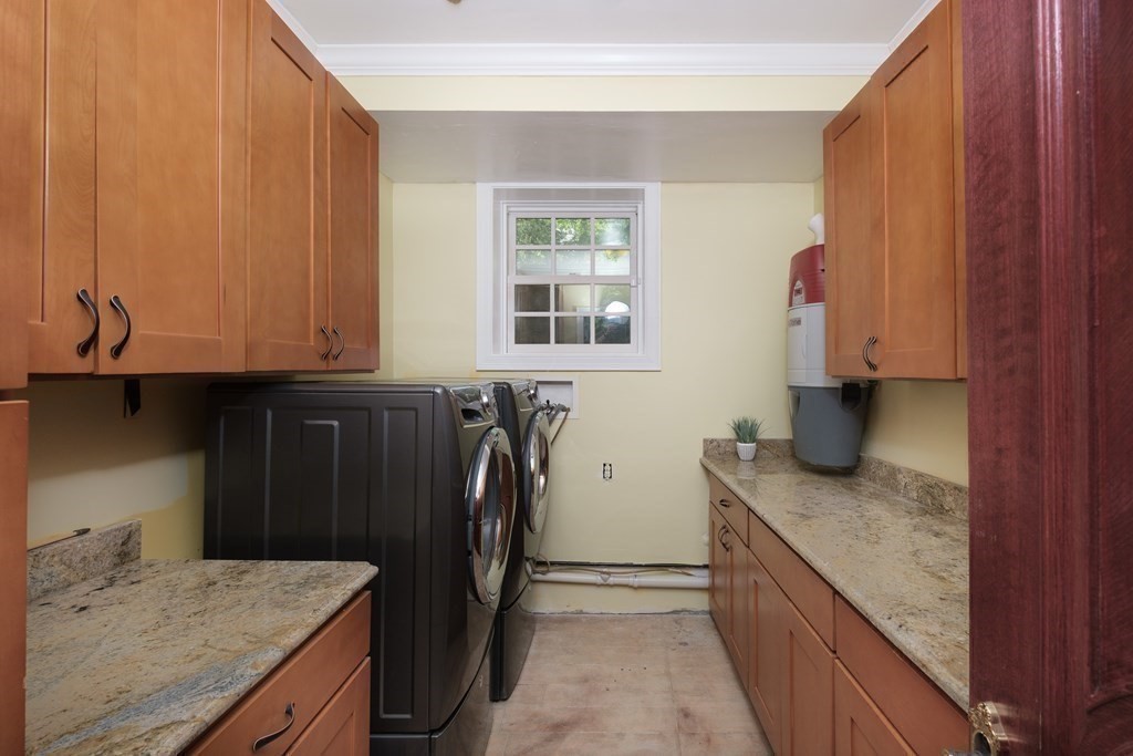 7 Evergreen Avenue Weston, MA 02493 - Photo 30 of 42 a kitchen with granite countertop a sink a stove and a refrigerator