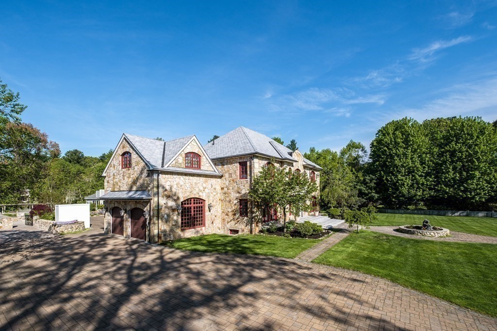 7 Evergreen Avenue Weston, MA 02493 - Photo 3 of 42 a front view of a house with a yard