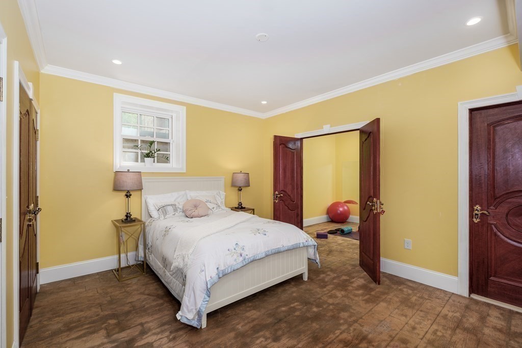 7 Evergreen Avenue Weston, MA 02493 - Photo 31 of 42 a bedroom with a bed lamp and a window