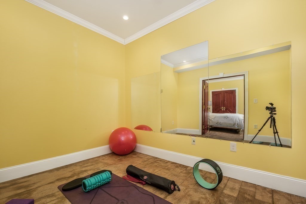 7 Evergreen Avenue Weston, MA 02493 - Photo 32 of 42 a view of a room with furniture and wooden floor