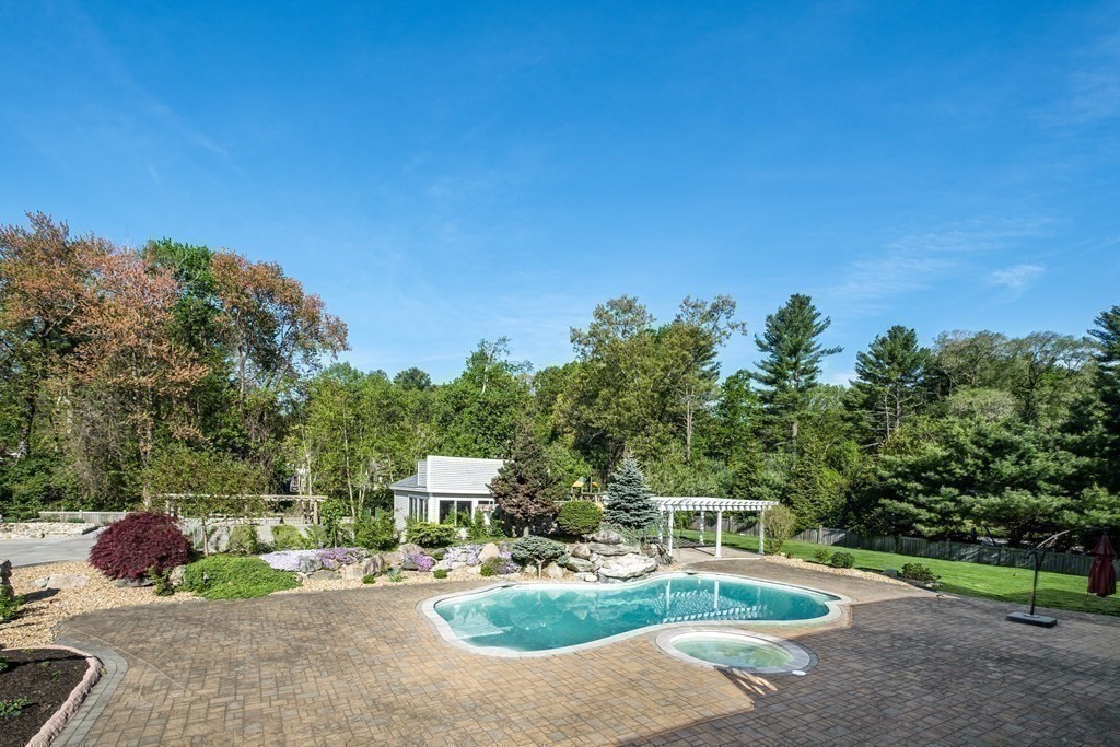 7 Evergreen Avenue Weston, MA 02493 - Photo 34 of 42 a view of a chair and tables in the patio
