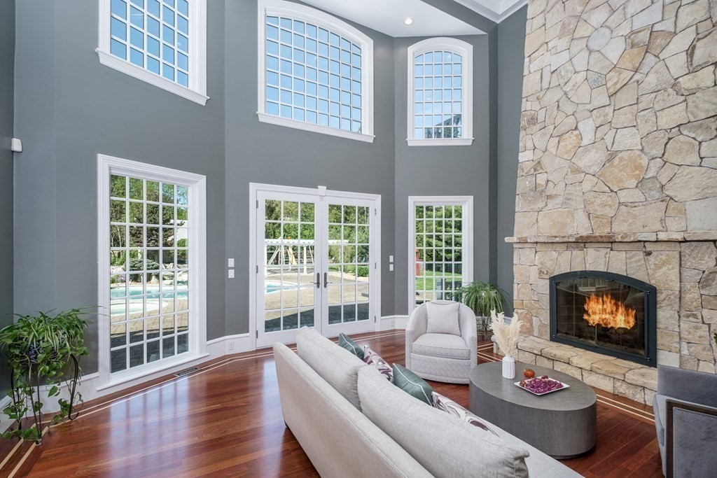 7 Evergreen Avenue Weston, MA 02493 - Photo 4 of 42 a living room with furniture and a fireplace