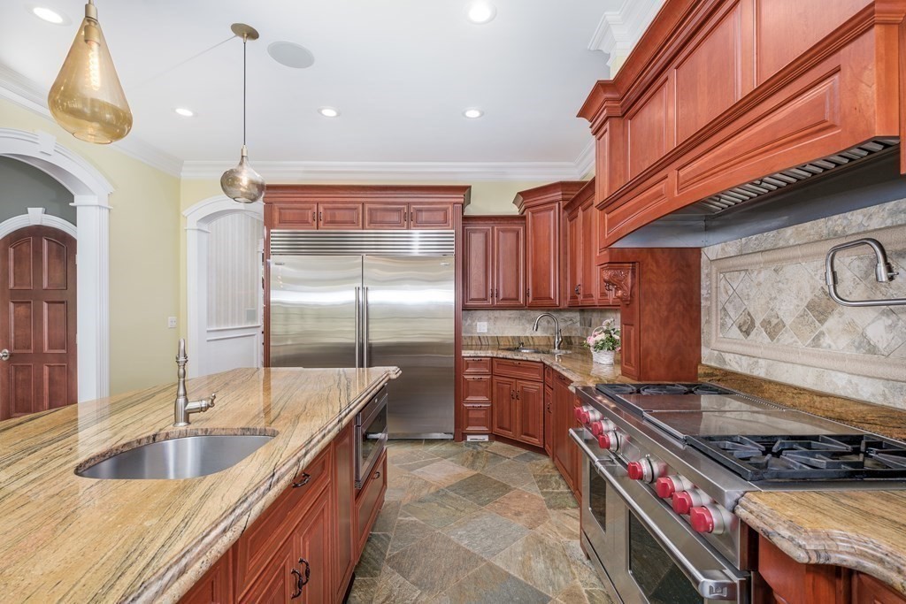 7 Evergreen Avenue Weston, MA 02493 - Photo 7 of 42 a kitchen with stainless steel appliances granite countertop a sink a stove and a wooden floors
