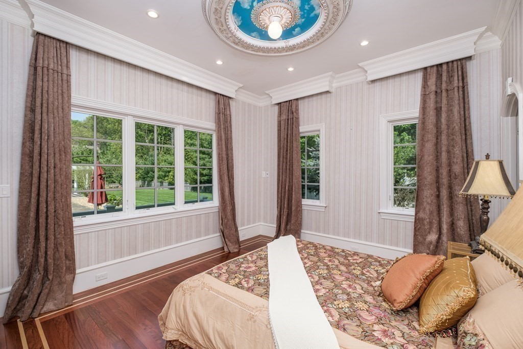 7 Evergreen Avenue Weston, MA 02493 - Photo 10 of 42 a bedroom with a bed and a large window