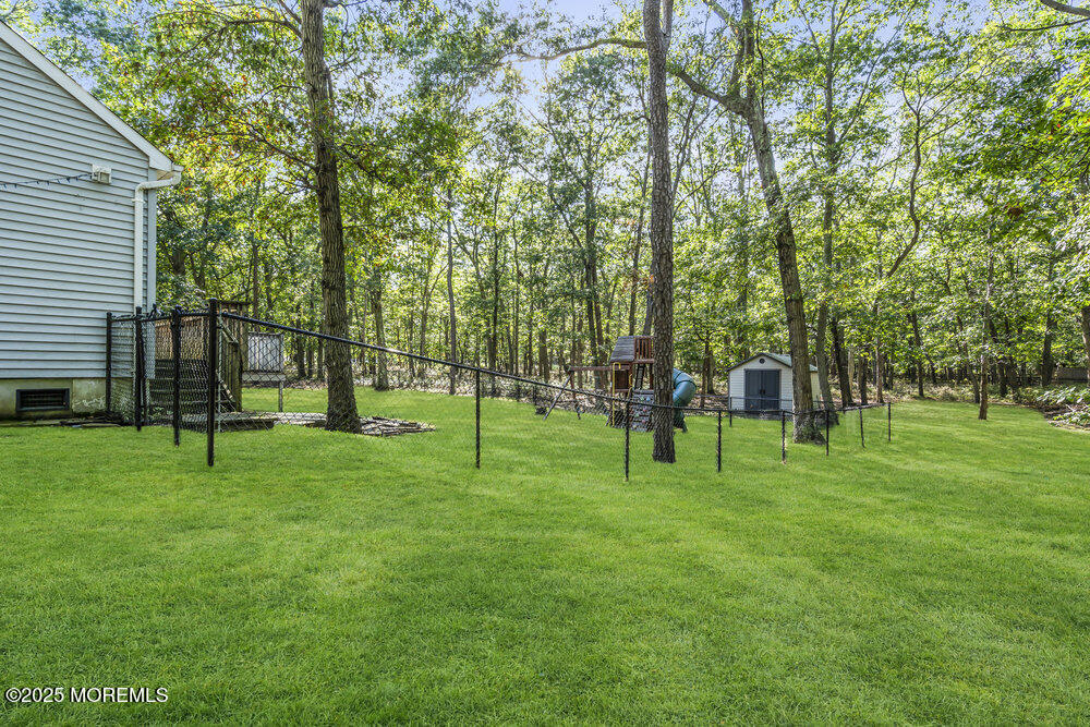426 Basso Street Jackson, NJ 08527 - Photo 11 of 11 a green field with lots of trees