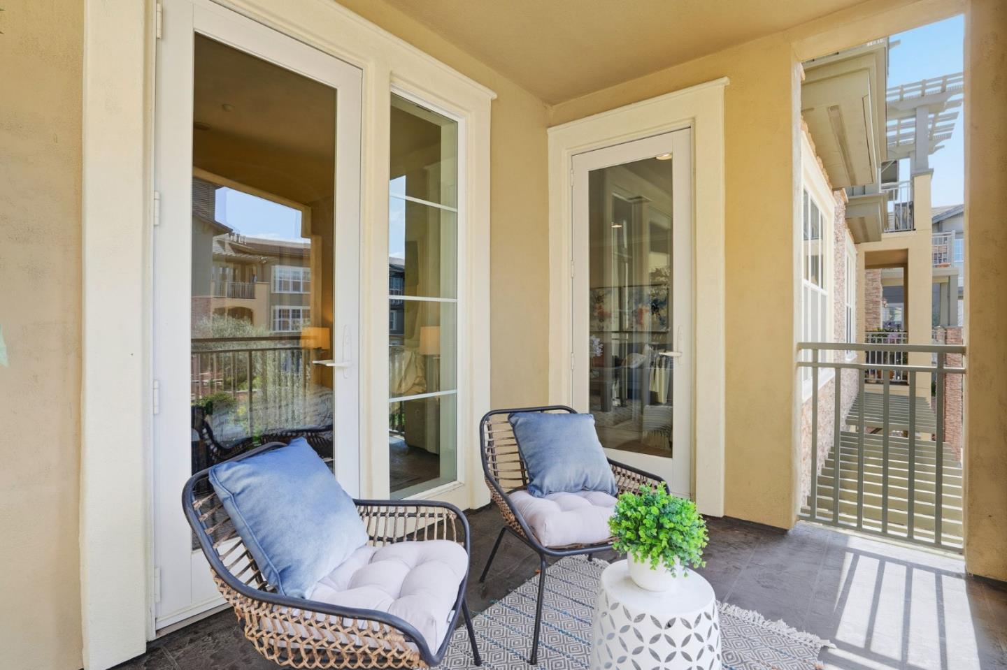 2881 Meridian Avenue, Unit 217 San Jose, CA 95124 - Photo 29 of 39 a balcony with furniture and a potted plant