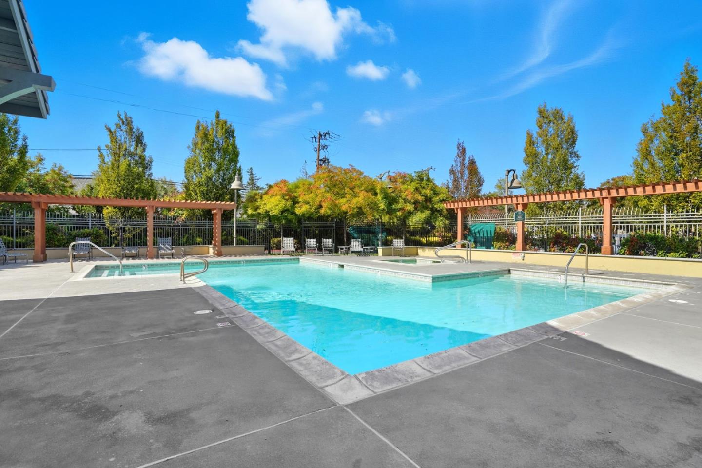 2881 Meridian Avenue, Unit 217 San Jose, CA 95124 - Photo 39 of 39 a view of a swimming pool with an outdoor seating and a palm tree