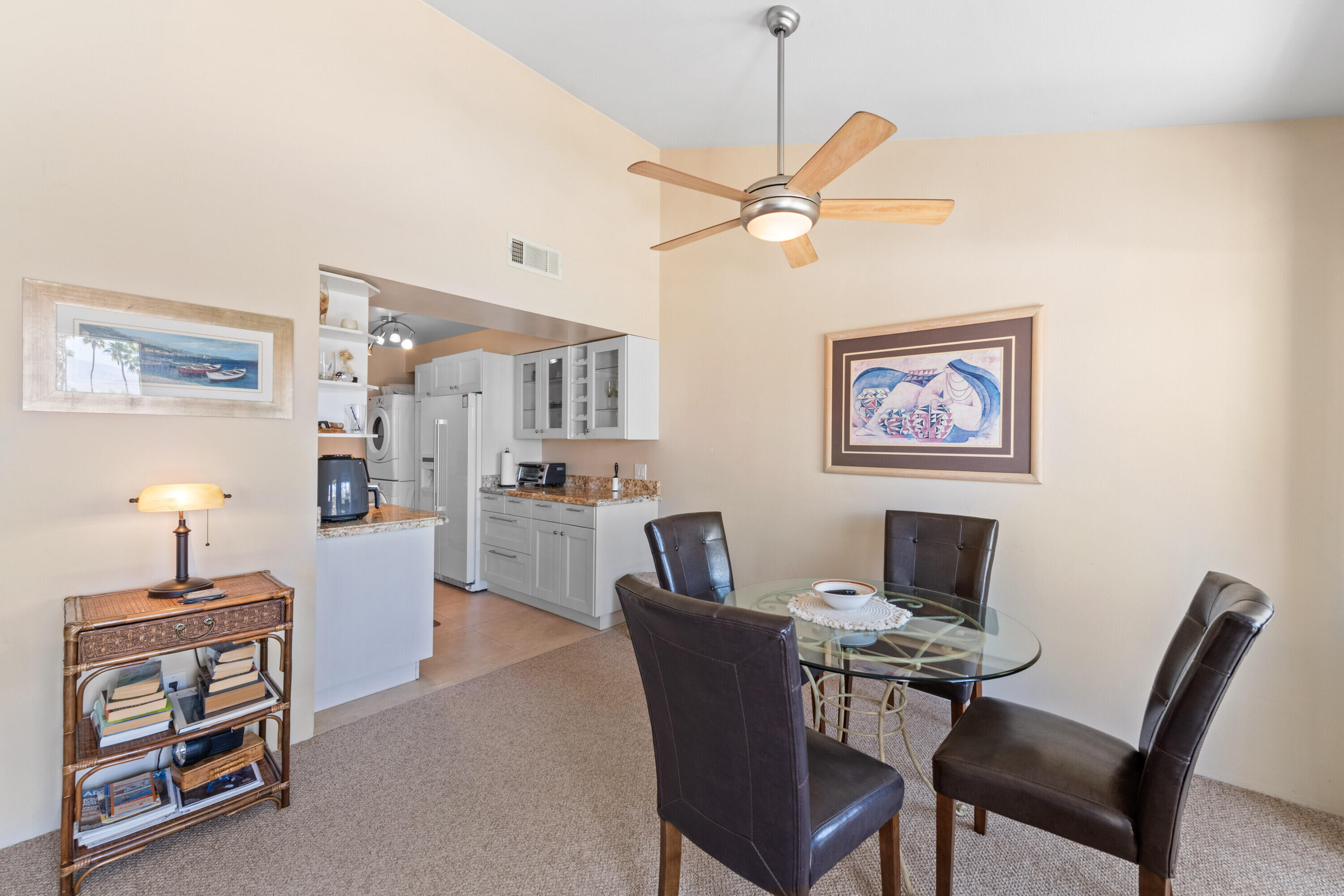 1150 East Amado Road, Unit 20C2 Palm Springs, CA 92262 - Photo 12 of 14 a view of a livingroom with furniture and a chandelier