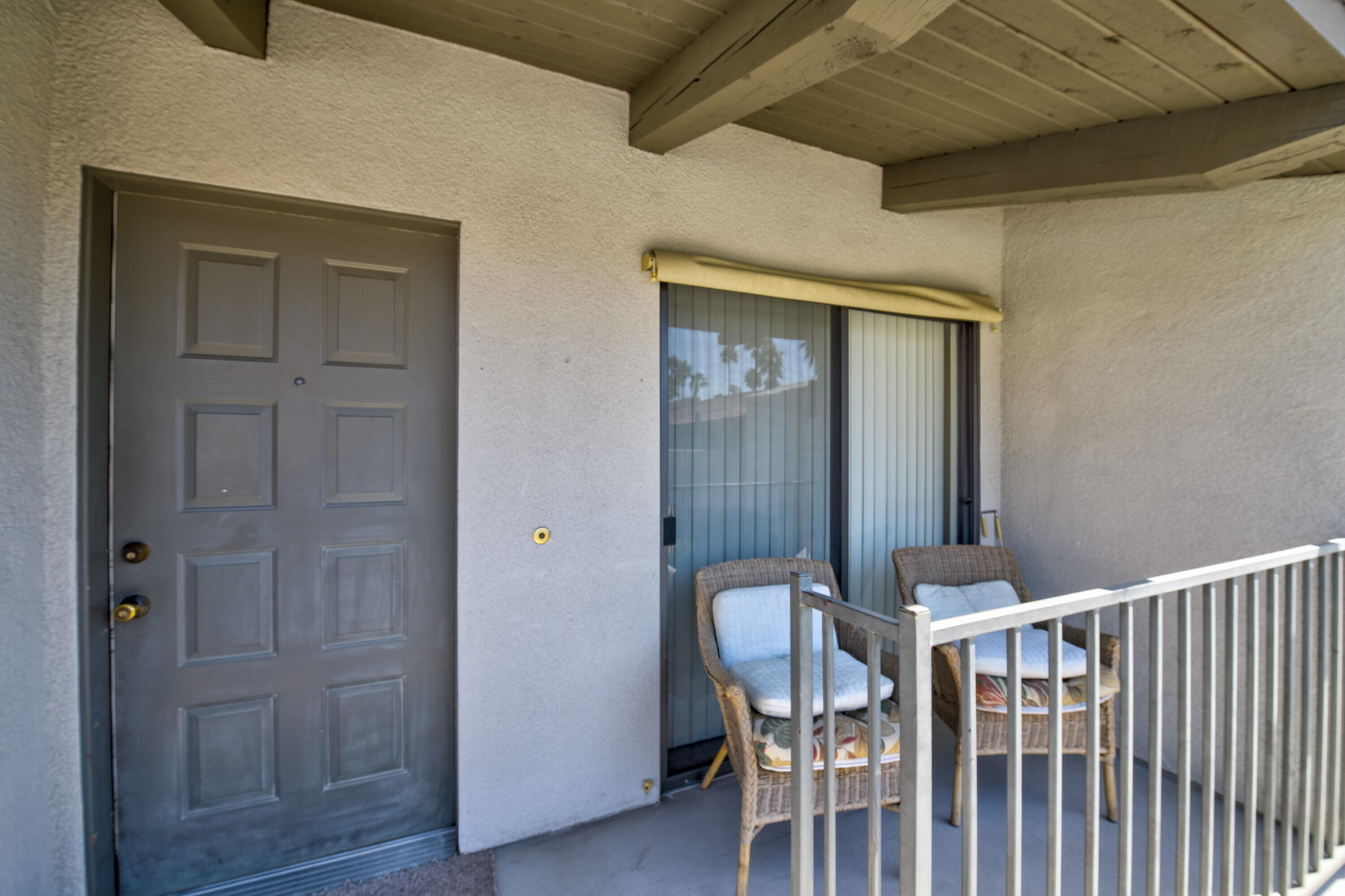 1150 East Amado Road, Unit 20C2 Palm Springs, CA 92262 - Photo 5 of 14 a view of a hallway with wooden floor and staircase