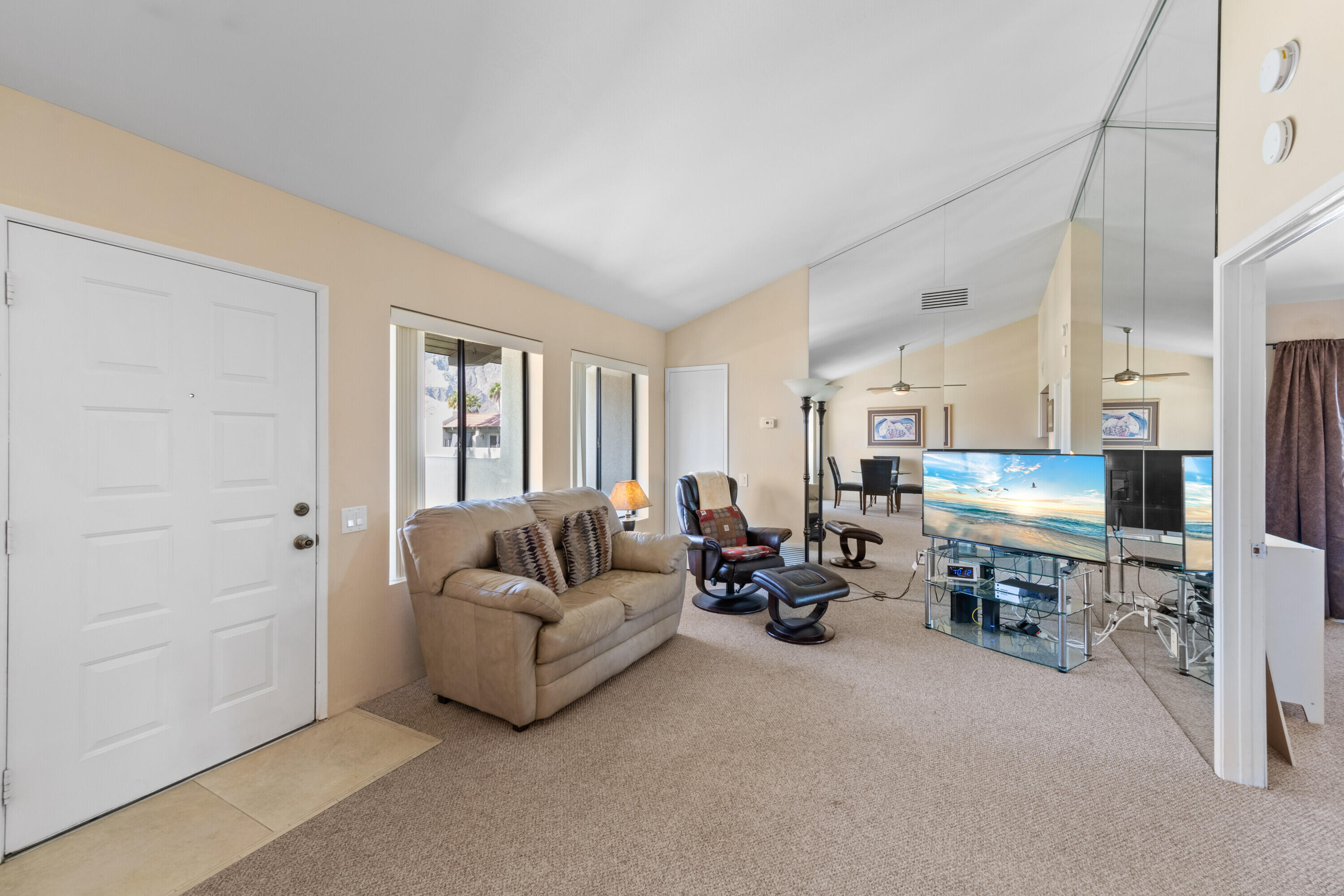 1150 East Amado Road, Unit 20C2 Palm Springs, CA 92262 - Photo 6 of 14 a living room with furniture and a couch