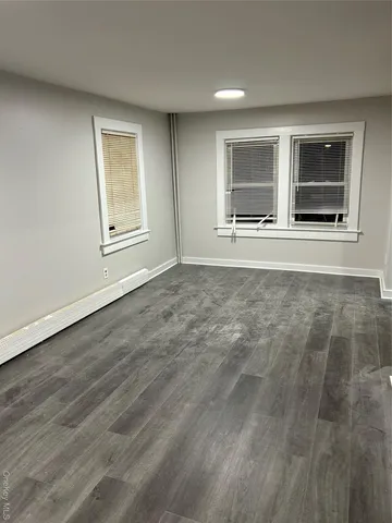 a kitchen with granite countertop cabinets and window