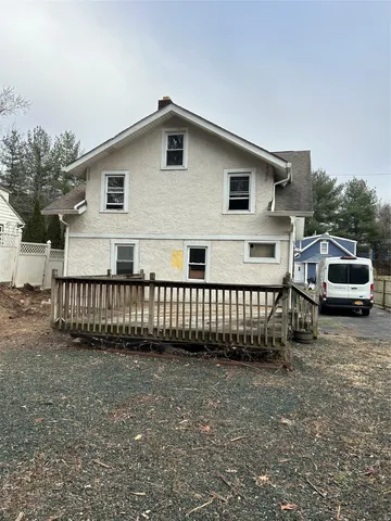 a white toilet sitting next to a bathroom sink