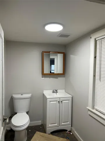 a bathroom with a shower and a shower