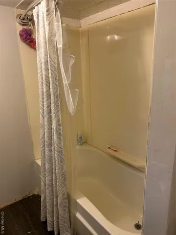 a bathroom with a sink mirror and toilet