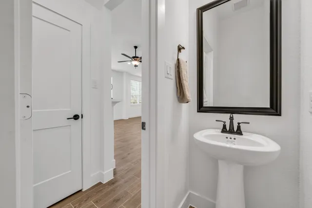 a bathroom with a sink and a mirror