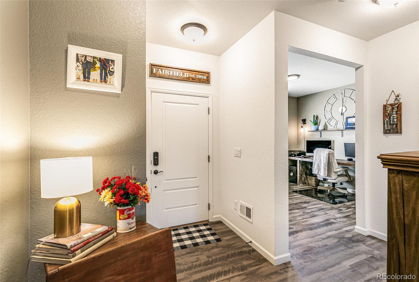 42891 Hawktree Circle Elizabeth, CO 80107 - Photo 13 of 39 a living room with furniture and a wooden floor
