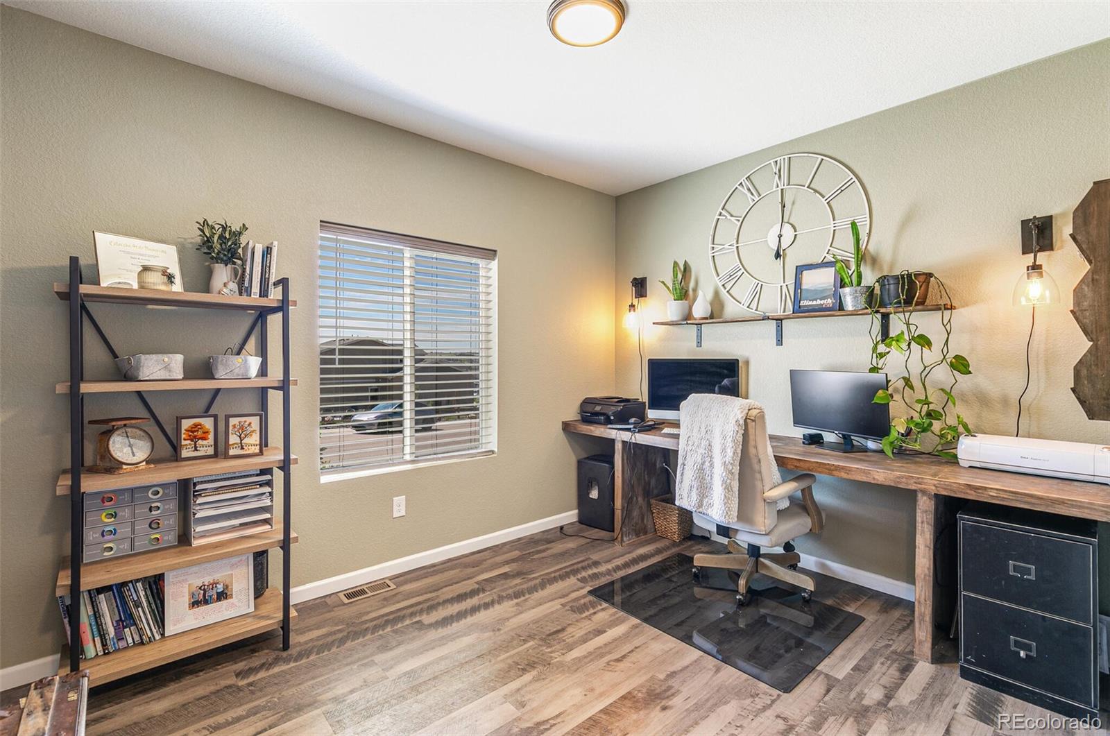 42891 Hawktree Circle Elizabeth, CO 80107 - Photo 14 of 39 a view of a workspace with furniture and a window