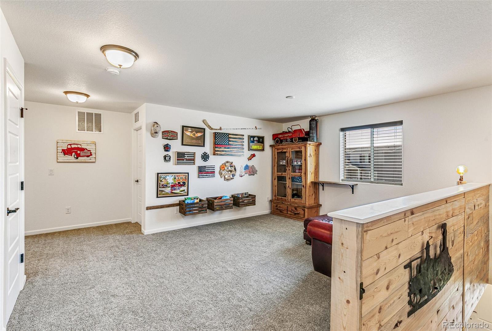 42891 Hawktree Circle Elizabeth, CO 80107 - Photo 18 of 39 a view of an empty room with toys