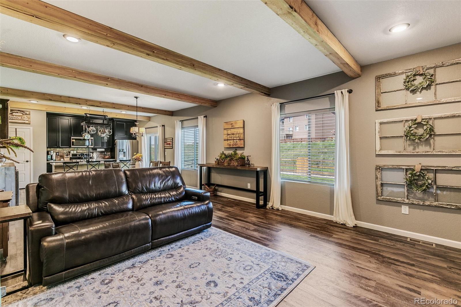 42891 Hawktree Circle Elizabeth, CO 80107 - Photo 3 of 39 a living room with furniture and wooden floor