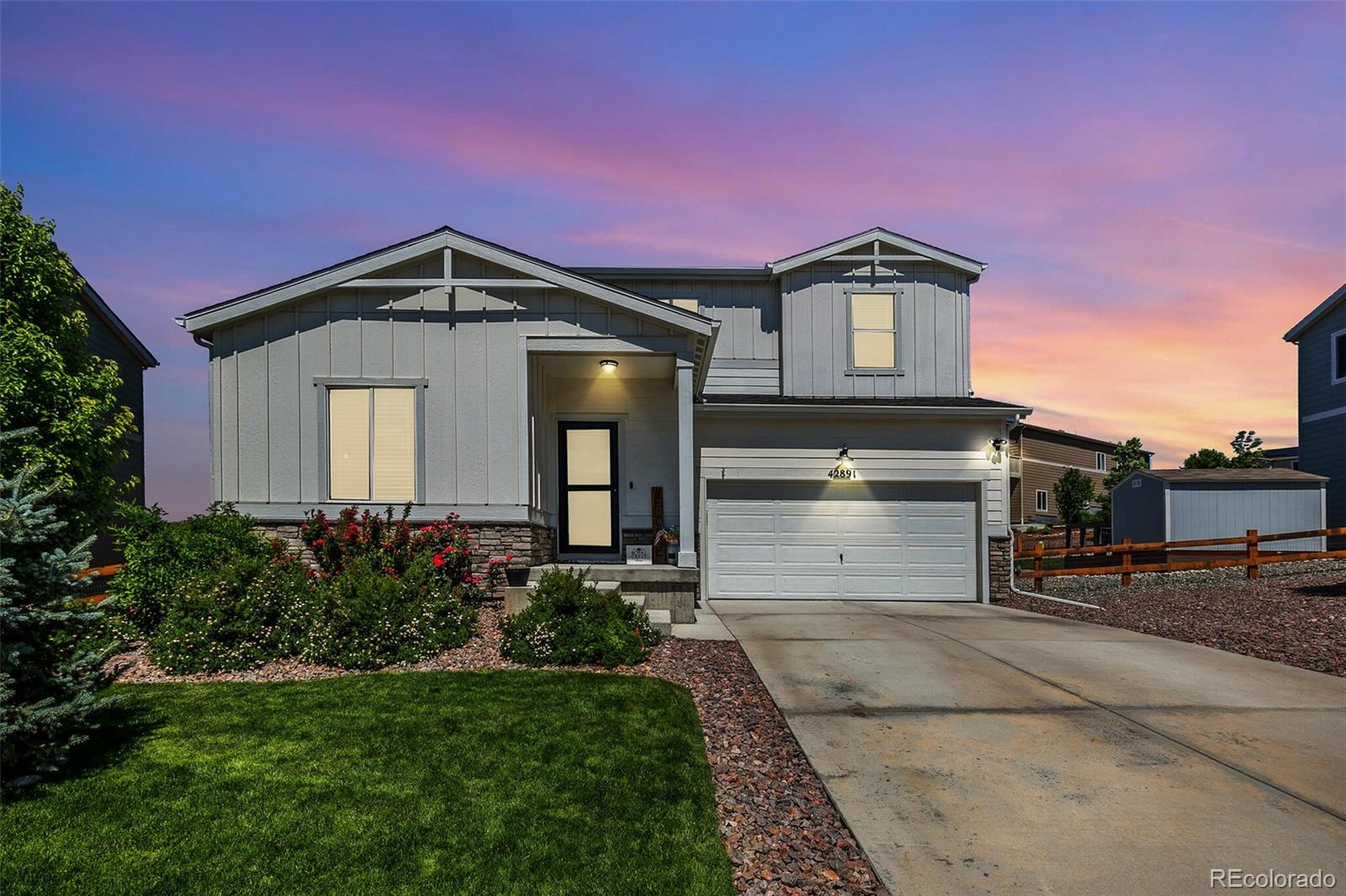 42891 Hawktree Circle Elizabeth, CO 80107 - Photo 31 of 39 a front view of a house with a yard and garage
