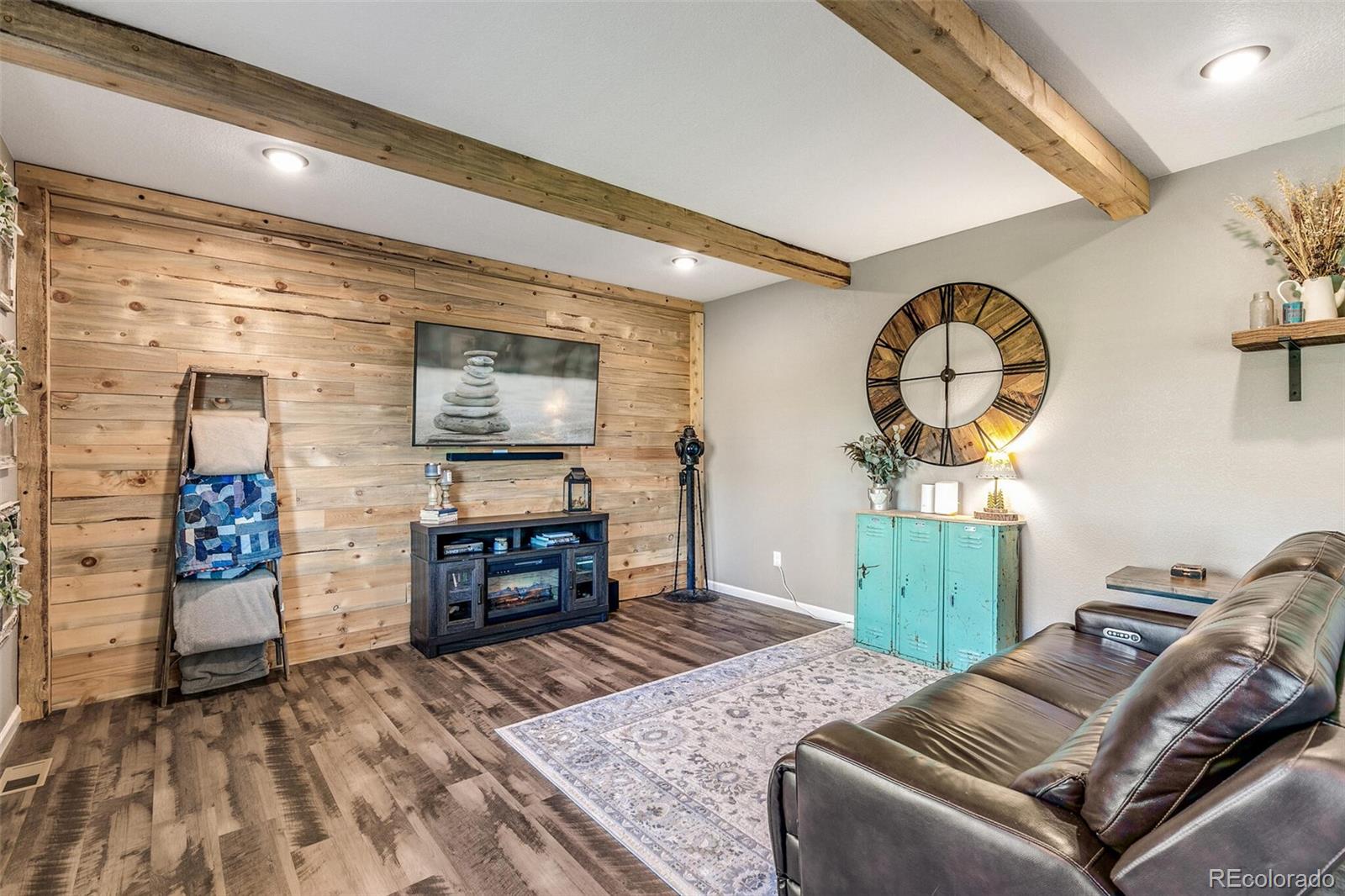 42891 Hawktree Circle Elizabeth, CO 80107 - Photo 6 of 39 a bedroom with a bed and wooden floor