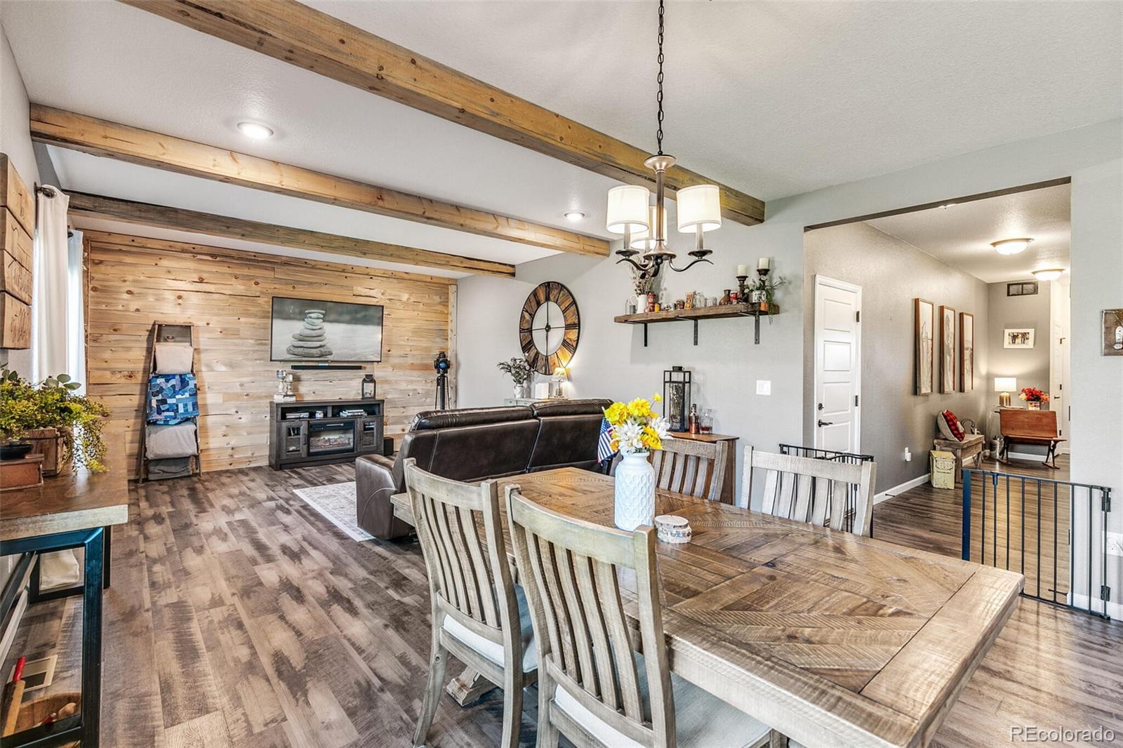 42891 Hawktree Circle Elizabeth, CO 80107 - Photo 7 of 39 a living room with lots of furniture and a table