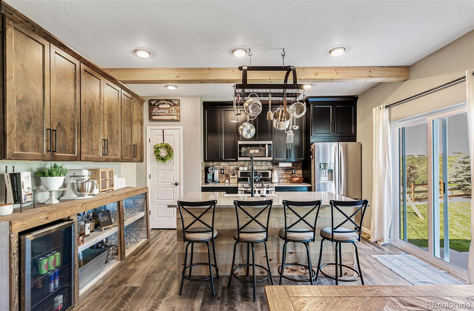 42891 Hawktree Circle Elizabeth, CO 80107 - Photo 8 of 39 a view of a dining room with furniture and chandelier