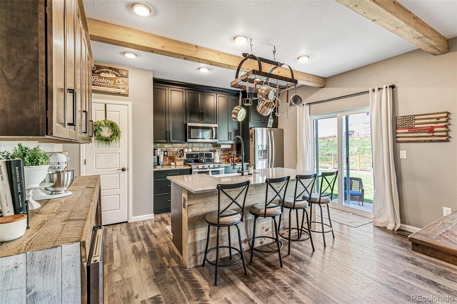 42891 Hawktree Circle Elizabeth, CO 80107 - Photo 9 of 39 a view of a dining room with furniture window and outside view