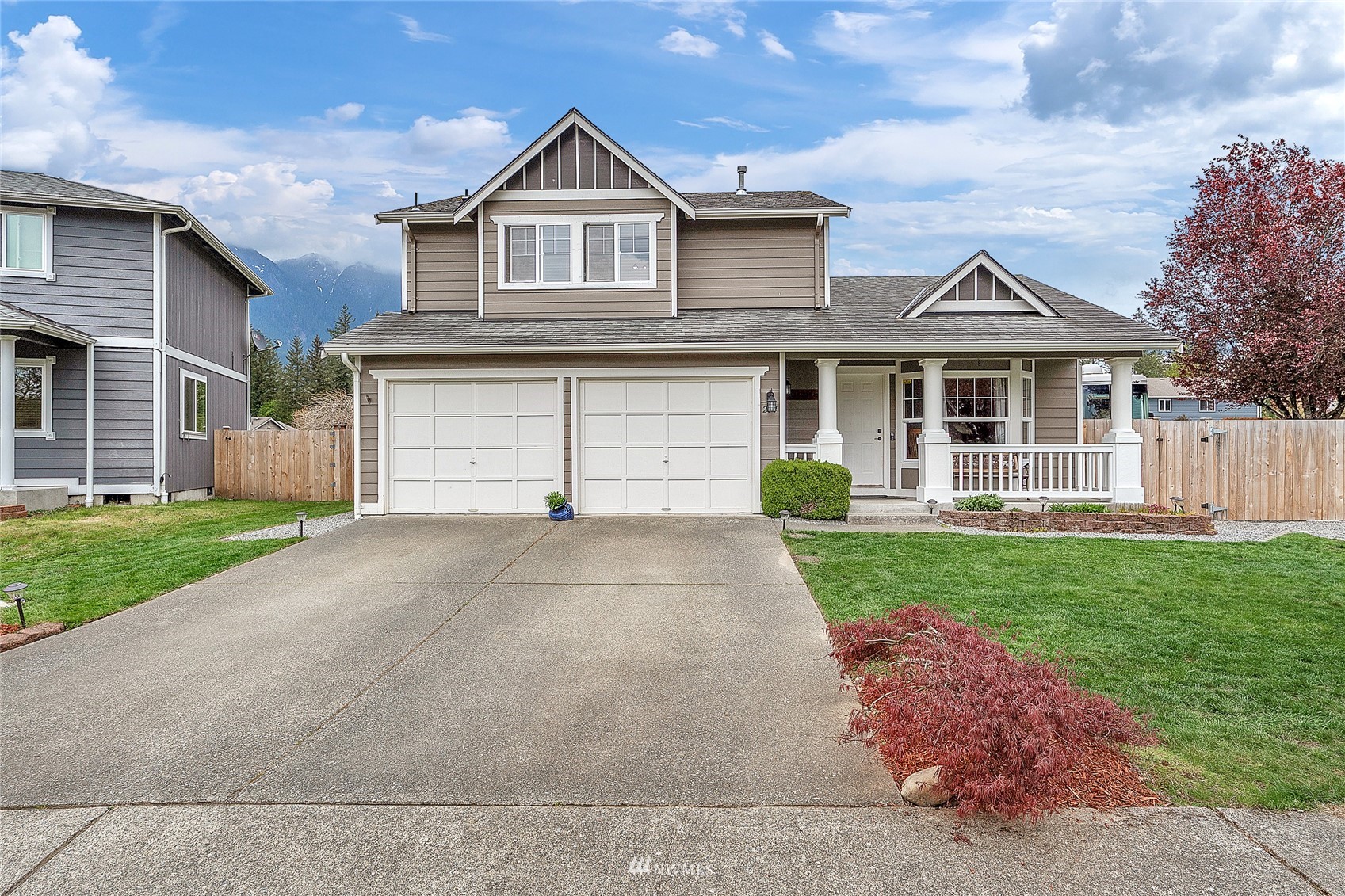 234 17th Street Gold Bar, WA 98251 - Photo 1 of 25 a front view of a house with a yard and garage