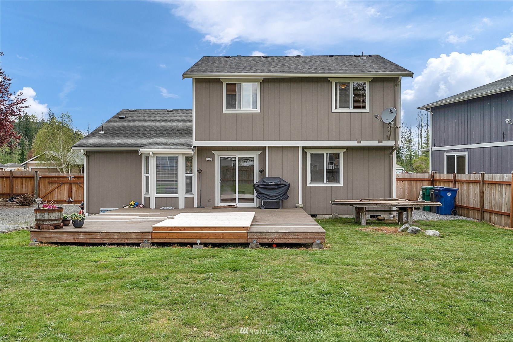 234 17th Street Gold Bar, WA 98251 - Photo 17 of 25 a front view of a house with a yard and trees
