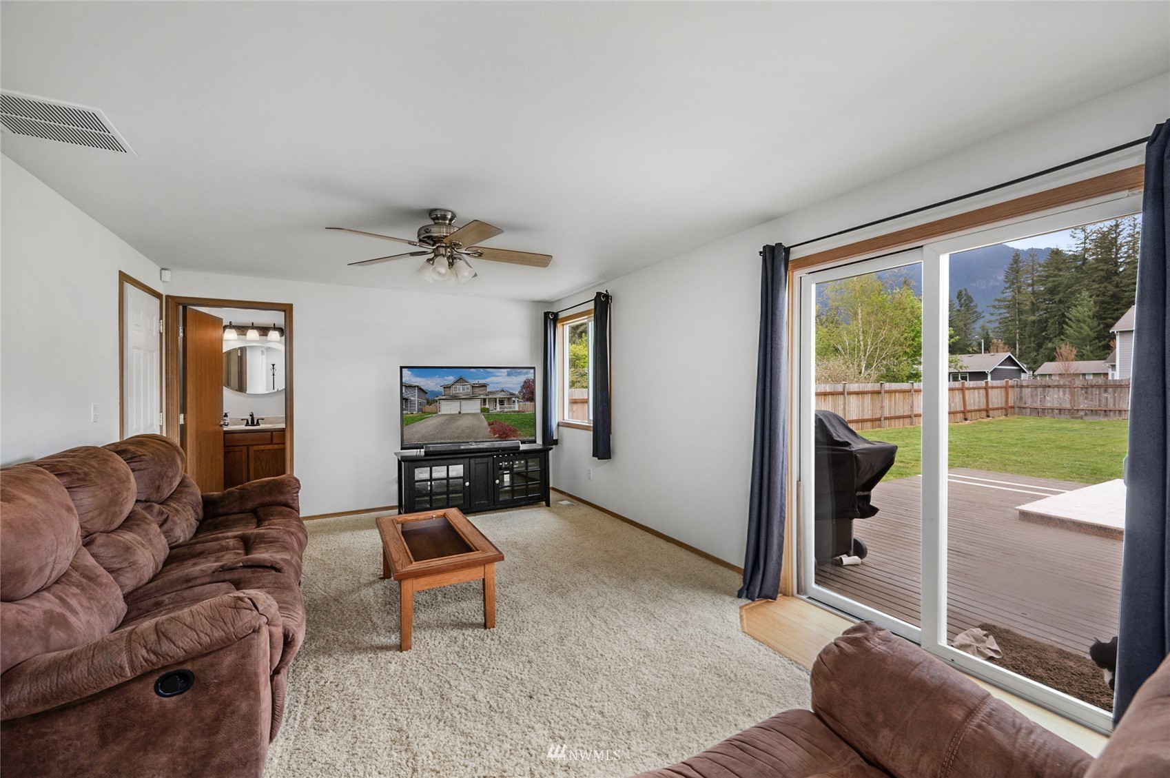 234 17th Street Gold Bar, WA 98251 - Photo 5 of 25 a living room with furniture and a floor to ceiling window