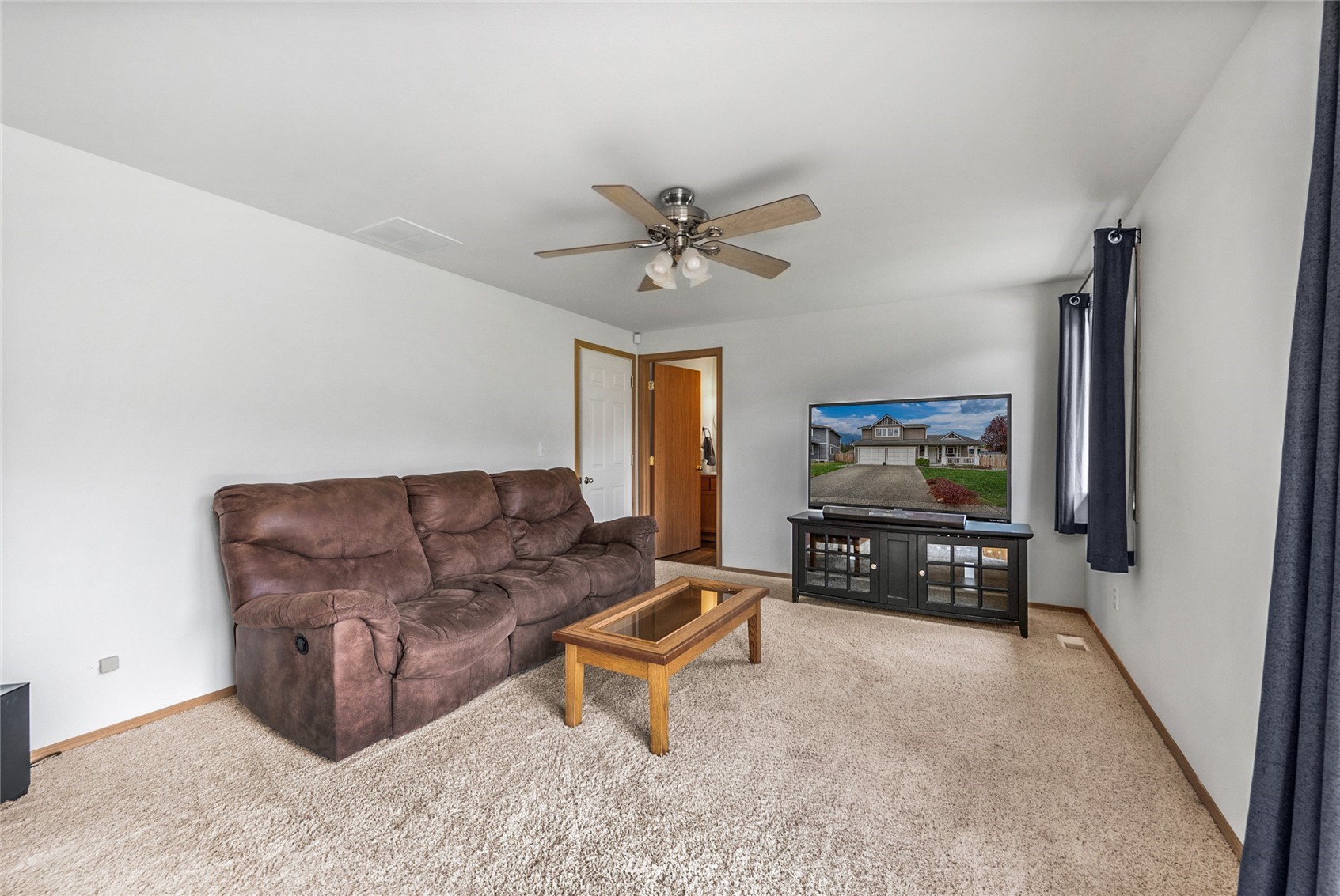 234 17th Street Gold Bar, WA 98251 - Photo 6 of 25 a living room with furniture and a flat screen tv