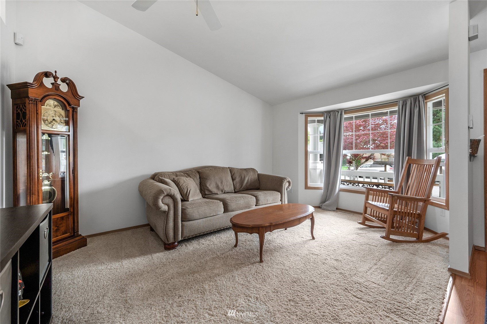 234 17th Street Gold Bar, WA 98251 - Photo 9 of 25 a living room with furniture a window and a flat screen tv