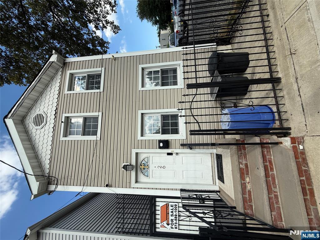 a front view of a house with glass windows