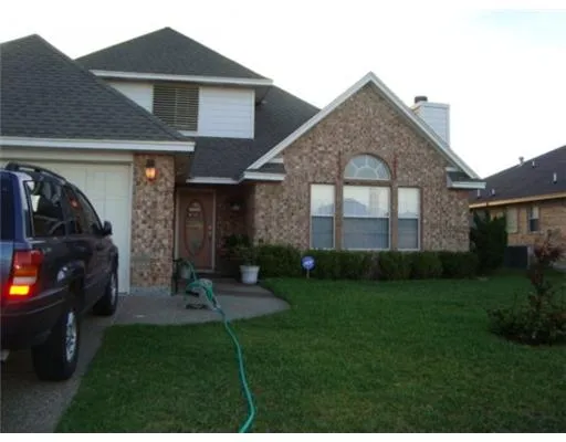 a view of a car in front of house